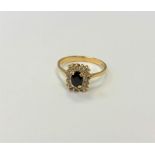 An 18ct gold sapphire and diamond ring