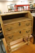 A light oak two drawer telephone table