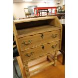 A light oak two drawer telephone table