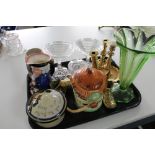 A tray of brass candlesticks, cocktail glasses,