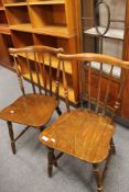 A pair of stick back beech armchairs