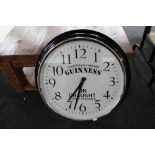 A reproduction wall clock - Guinness on draught