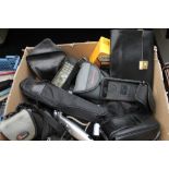 A box of assorted cameras including Kodak, Pentax, Praktica, binoculars,