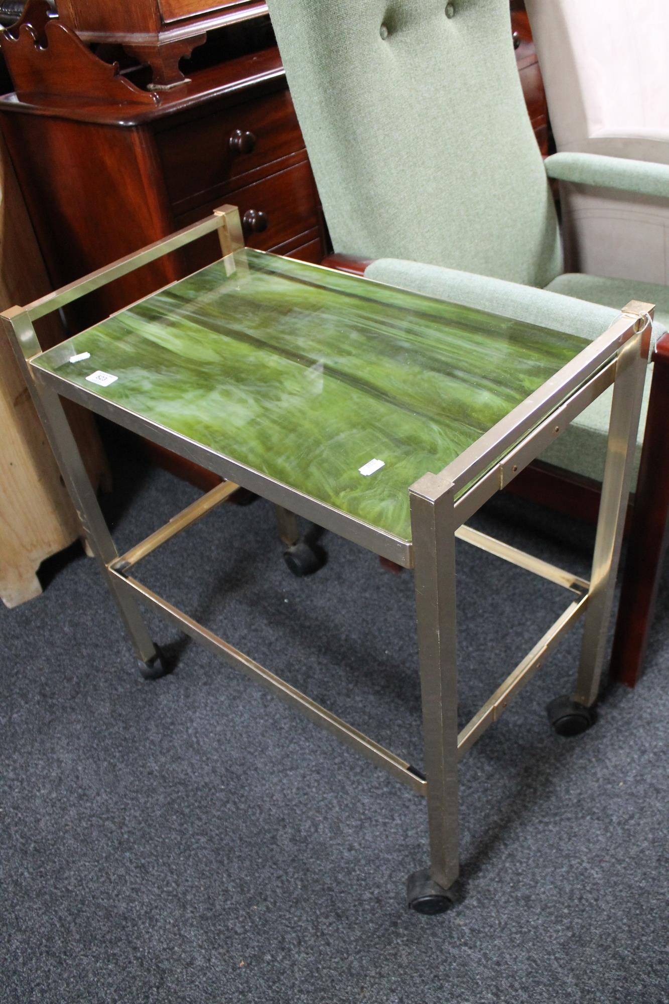 A metal framed drinks trolley