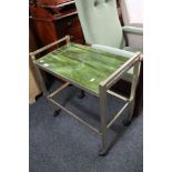 A metal framed drinks trolley