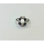 An antique 18ct sapphire and diamond horseshoe style ring