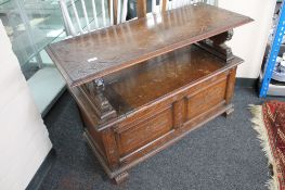 A carved oak monk's bench