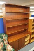 A mid century office sliding door bookcase