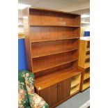 A mid century office sliding door bookcase