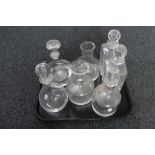 A tray of glass decanters,