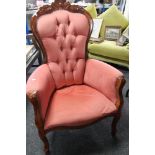 A reproduction Victorian style armchair in buttoned upholstery