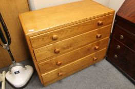 An oak four drawer chest