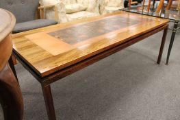 A mid century Scandinavian coffee table with inset copper panel CONDITION REPORT: