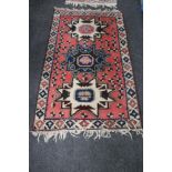 A Caucasian design rug,