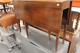 An early twentieth century mahogany flap sided table