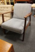 A mid century teak armchair CONDITION REPORT: Mark to seat.