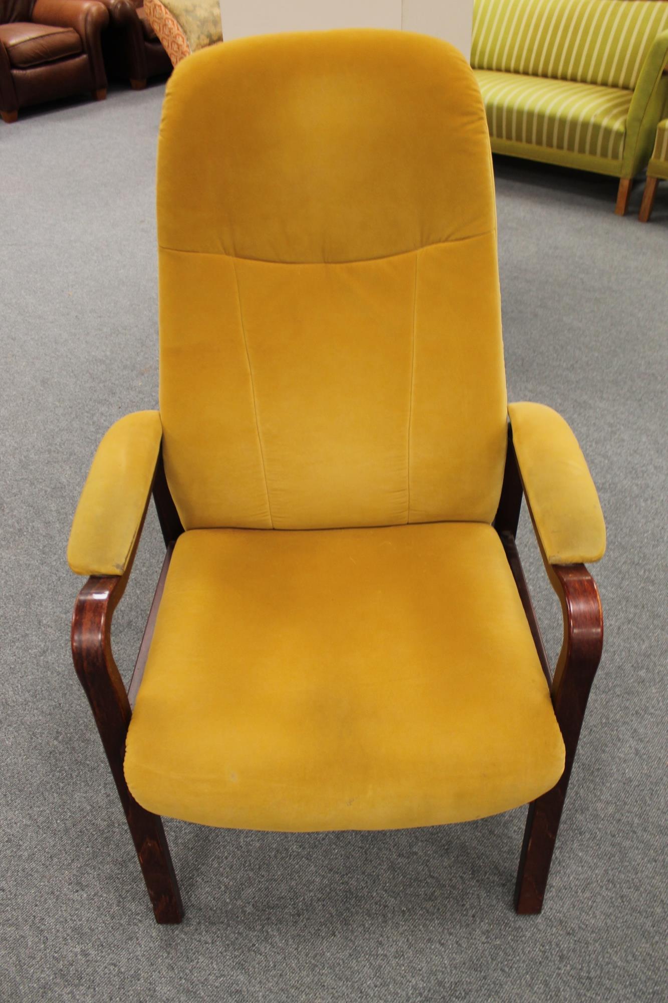 A stained beech framed armchair in mustard fabric