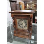 A continental oak cased bracket clock with silvered dial