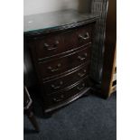 A reproduction mahogany four drawer miniature chest
