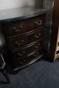 A reproduction mahogany four drawer miniature chest