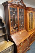 A reproduction mahogany Georgian style bureau bookcase