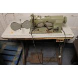 An industrial Necchi sewing machine in Singer table