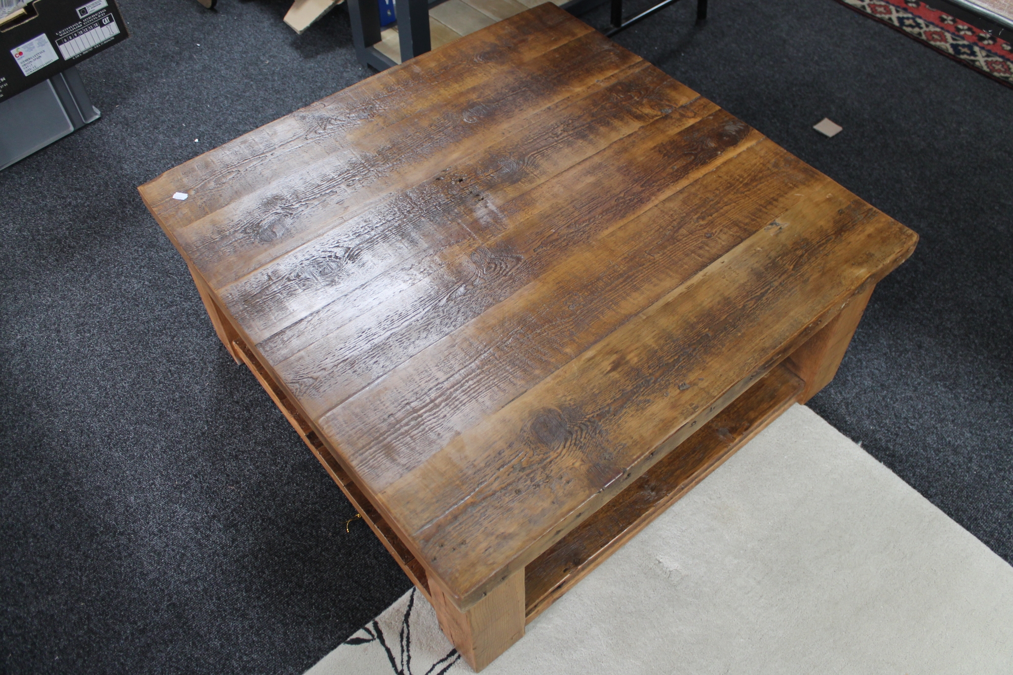 A heavy pine square coffee table