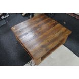 A heavy pine square coffee table