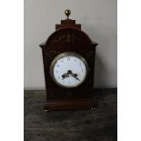 An Edwardian inlaid mahogany mantel clock