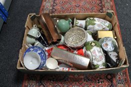 A box of decorative vases, blue and white china cups,