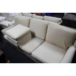 A Delcor four seater settee and matching three seater with matching footstool