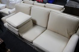 A Delcor four seater settee and matching three seater with matching footstool