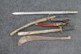 A vintage machete and other bladed weapons,