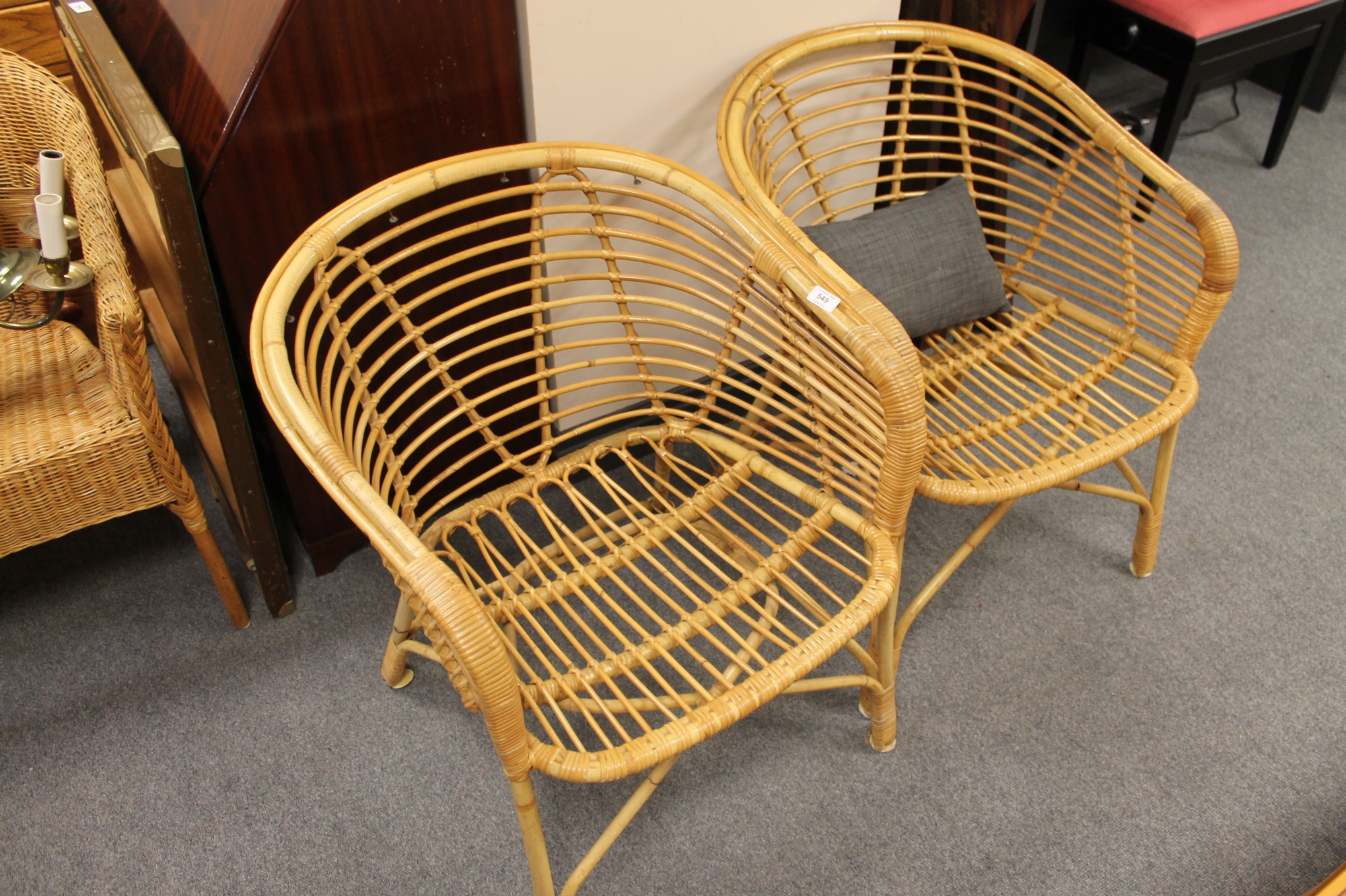 A pair of wicker armchairs