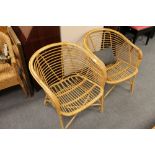 A pair of wicker armchairs