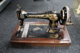 An antique singer sewing machine with accessories