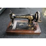 An antique singer sewing machine with accessories