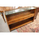 A teak side cabinet fitted with three drawers