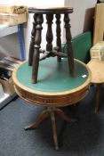 A leather topped three drawer drum table and a low oak stool