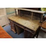 A nineteenth century carved oak desk