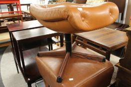 Two brown leather footstools