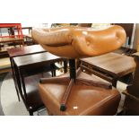 Two brown leather footstools