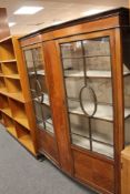 An early twentieth century inlaid mahogany display cabinet