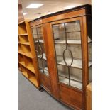 An early twentieth century inlaid mahogany display cabinet