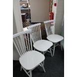 A set of three painted contemporary dining chairs
