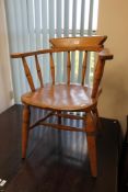 An early twentieth century elm half smoker chair