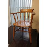 An early twentieth century elm half smoker chair