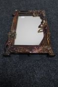 An Art Nouveau style mirrored frame