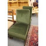 A pair of green dralon chairs