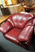 A Burgundy leather armchair